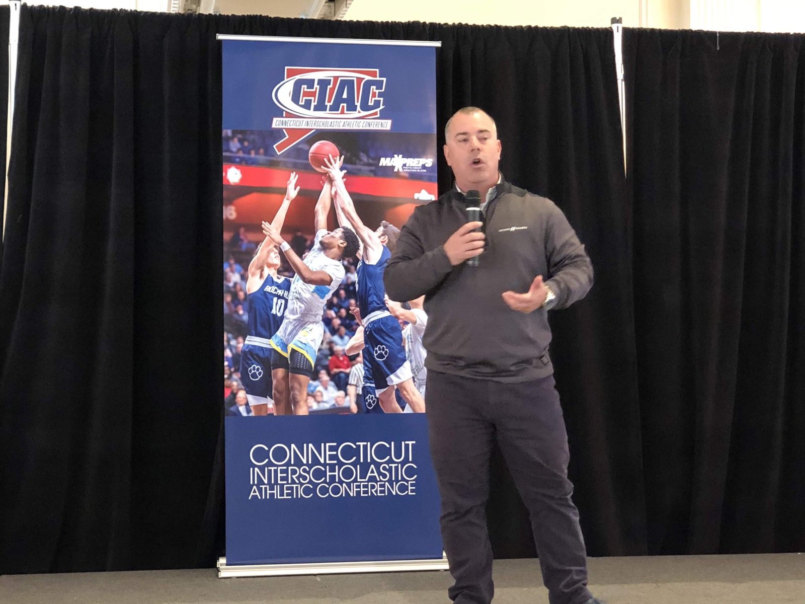 Joe Bouffard speaking at a sports organization event
